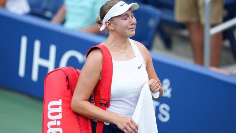 Aug 30, 2022; Flushing, NY, USA; Amanda Anisimova of the United States reacts as she walks off the court after losing her first round match to Yulia Putintseva of Kazakhstan on day two of the 2022 U.S. Open tennis tournament at USTA Billie Jean King National Tennis Center. Mandatory Credit: Danielle Parhizkaran-USA TODAY Sports