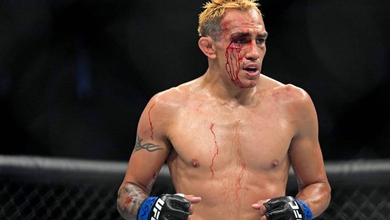 Sep 10, 2022; Las Vegas, Nevada, USA; Tony Ferguson (blue gloves) during UFC 279 at T-Mobile Arena. Mandatory Credit: Joe Camporeale-USA TODAY Sports