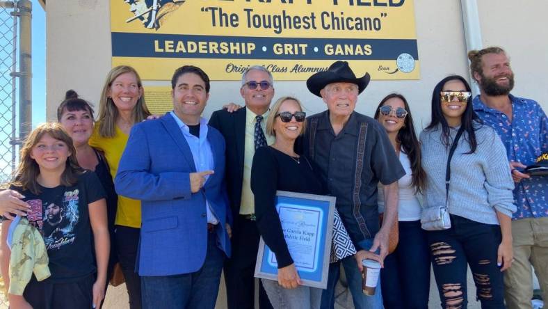 Joe Kapp and his family gather by a field sign created to honor the former NFL player's legacy at El Sausal Middle School in Salinas, Calif.

Jkappfamily