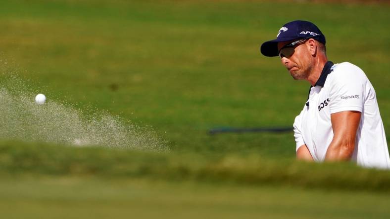 Oct 29, 2022; Miami, Florida, USA; Henrik Stenson plays his shot out of the 17th green side bunker during the second round of the season finale of the LIV Golf series at Trump National Doral. Mandatory Credit: John David Mercer-USA TODAY Sports