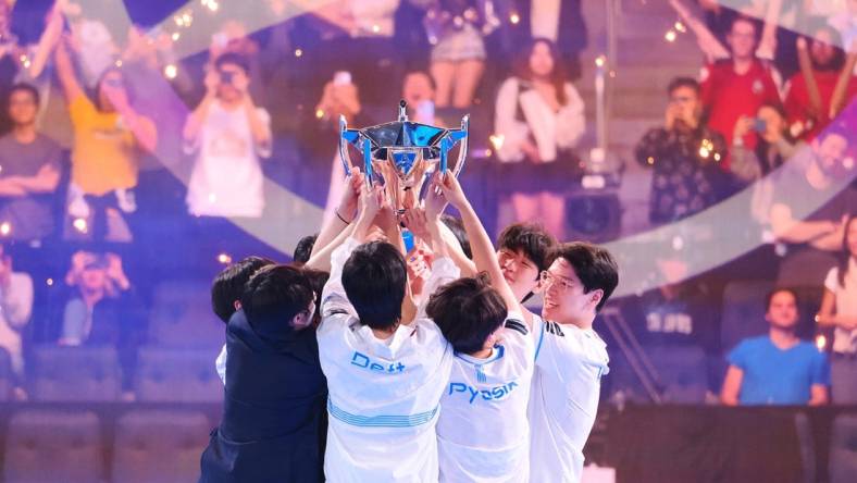 Nov 5, 2022; San Francisco, California, USA;  DRX players raise the Summoner's Cup Worlds 2022 trophy after winning the League of Legends World Championships against T1 at Chase Center. Mandatory Credit: Kelley L Cox-USA TODAY Sports