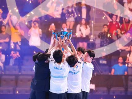 Nov 5, 2022; San Francisco, California, USA;  DRX players raise the Summoner's Cup Worlds 2022 trophy after winning the League of Legends World Championships against T1 at Chase Center. Mandatory Credit: Kelley L Cox-USA TODAY Sports
