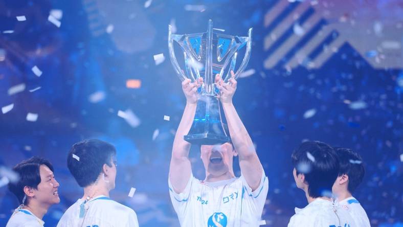 Nov 5, 2022; San Francisco, California, USA; DRX mid laner Kim "Zeka" Geon-woo holds up the Summoner's Cup Worlds 2022 trophy after winning the League of Legends World Championships against T1 at Chase Center. Mandatory Credit: Kelley L Cox-USA TODAY Sports