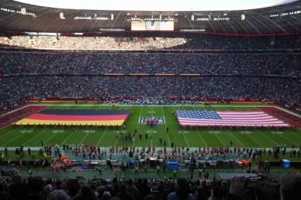 Nov 13, 2022; Munich, Germany; A general overall view of German and United States flags on the field during the playing of the national anthem before an NFL International Series game between the Tampa Bay Buccaneers and the Seattle Seahawks at Allianz Arena. Mandatory Credit: Kirby Lee-USA TODAY Sports