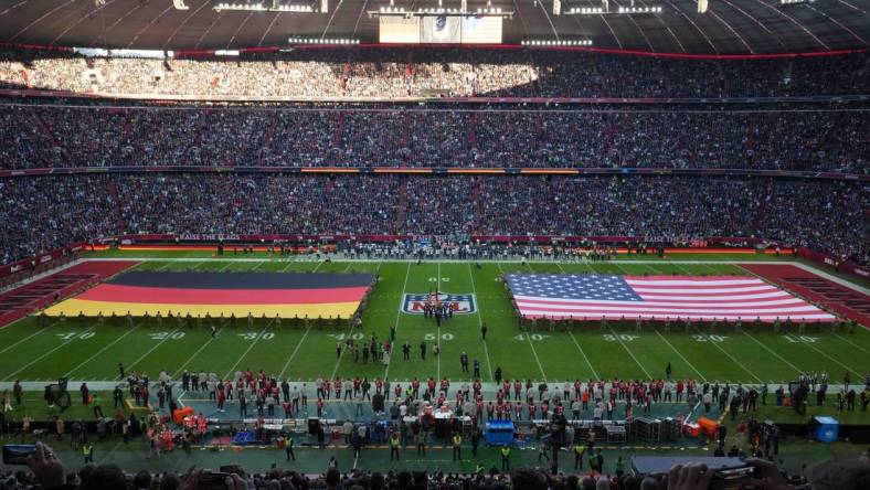 Nov 13, 2022; Munich, Germany; A general overall view of German and United States flags on the field during the playing of the national anthem before an NFL International Series game between the Tampa Bay Buccaneers and the Seattle Seahawks at Allianz Arena. Mandatory Credit: Kirby Lee-USA TODAY Sports