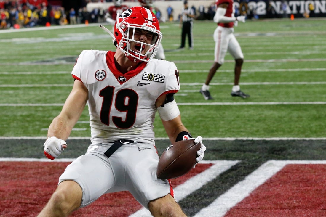 Georgia Bulldogs tight end Brock Bowers (19) celebrates after scoring a touchdown during the College Football Playoff National Championship against Alabama at Lucas Oil Stadium on Monday, Jan. 10, 2022, in Indianapolis. Georgia won 33-18.

News Joshua L Jones