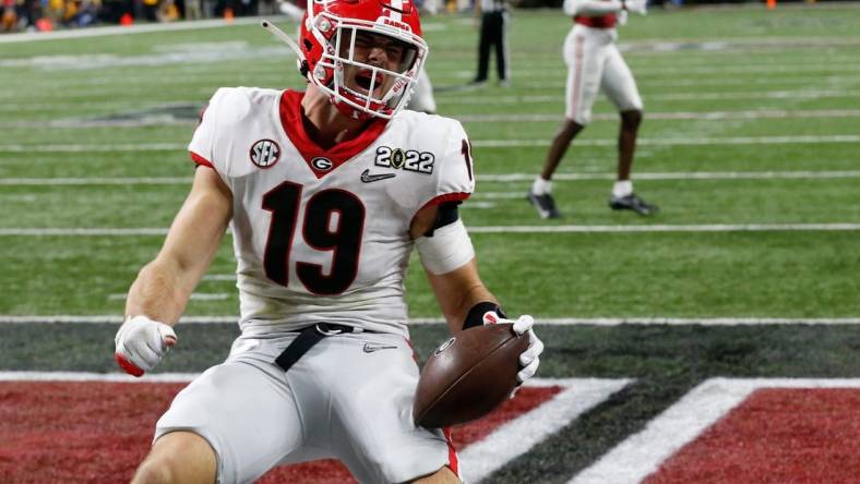 Georgia Bulldogs tight end Brock Bowers (19) celebrates after scoring a touchdown during the College Football Playoff National Championship against Alabama at Lucas Oil Stadium on Monday, Jan. 10, 2022, in Indianapolis. Georgia won 33-18.

News Joshua L Jones