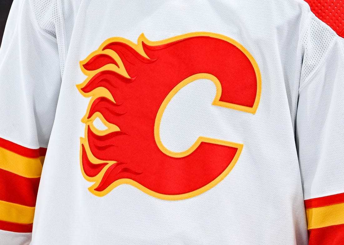 Dec 12, 2022; Montreal, Quebec, CAN; View of a Calgary Flames logo on a jersey worn by the member of the team during the second period at Bell Centre. Mandatory Credit: David Kirouac-USA TODAY Sports