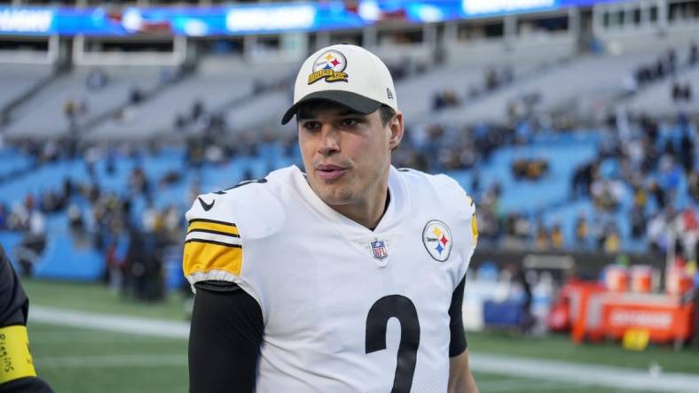 Dec 18, 2022; Charlotte, North Carolina, USA; Pittsburgh Steelers quarterback Mason Rudolph (2) walks off the field after the win over the Carolina Panthers at Bank of America Stadium. Mandatory Credit: Jim Dedmon-USA TODAY Sports