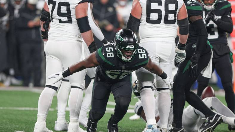 Dec 22, 2022; East Rutherford, New Jersey, USA; New York Jets defensive end Carl Lawson (58) celebrates a defensive stop during the first half against the Jacksonville Jaguars at MetLife Stadium. Mandatory Credit: Vincent Carchietta-USA TODAY Sports