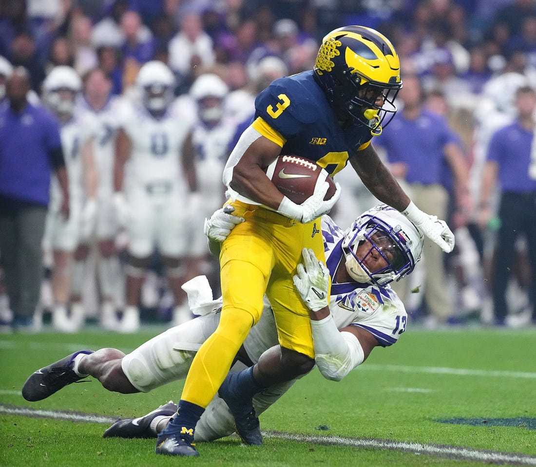 December 31, 2022; Glendale, Ariz; USA; TCU linebacker Dee Winters (13) tackles Michigan wide receiver AJ Henning (3) during the second half at State Farm Stadium. Mandatory Credit: Patrick Breen-Arizona Republic

Ncaa Fiesta Bowl Game