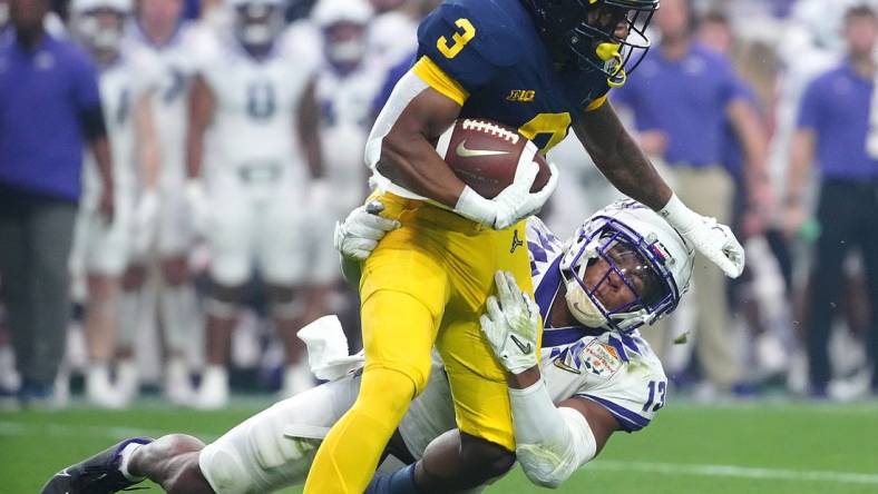 December 31, 2022; Glendale, Ariz; USA; TCU linebacker Dee Winters (13) tackles Michigan wide receiver AJ Henning (3) during the second half at State Farm Stadium. Mandatory Credit: Patrick Breen-Arizona Republic

Ncaa Fiesta Bowl Game