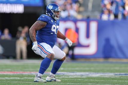 Jan 1, 2023; East Rutherford, New Jersey, USA; New York Giants defensive tackle Dexter Lawrence (97) celebrates a defensive stop during the second half against the Indianapolis Colts at MetLife Stadium. Mandatory Credit: Vincent Carchietta-USA TODAY Sports