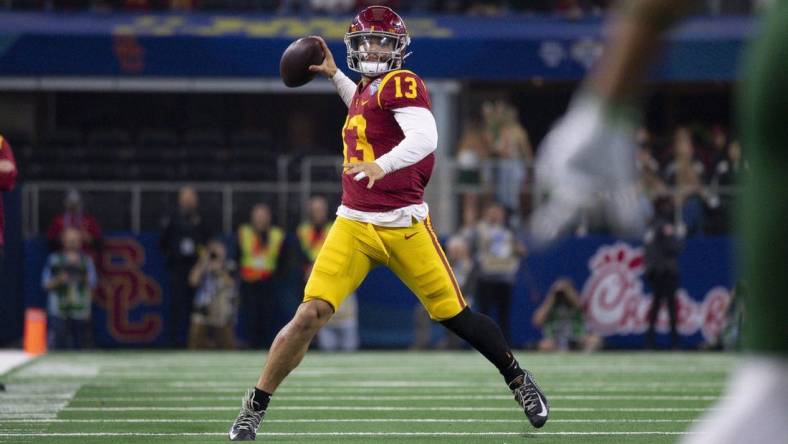 Jan 2, 2023; Arlington, Texas, USA; USC Trojans quarterback Caleb Williams (13) in action during the game between the USC Trojans and the Tulane Green Wave in the 2023 Cotton Bowl at AT&T Stadium. Mandatory Credit: Jerome Miron-USA TODAY Sports