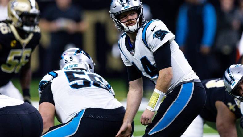 Jan 8, 2023; New Orleans, Louisiana, USA;  Carolina Panthers quarterback Sam Darnold (14) drops back to pass against the New Orleans Saints during the first half at Caesars Superdome. Mandatory Credit: Stephen Lew-USA TODAY Sports