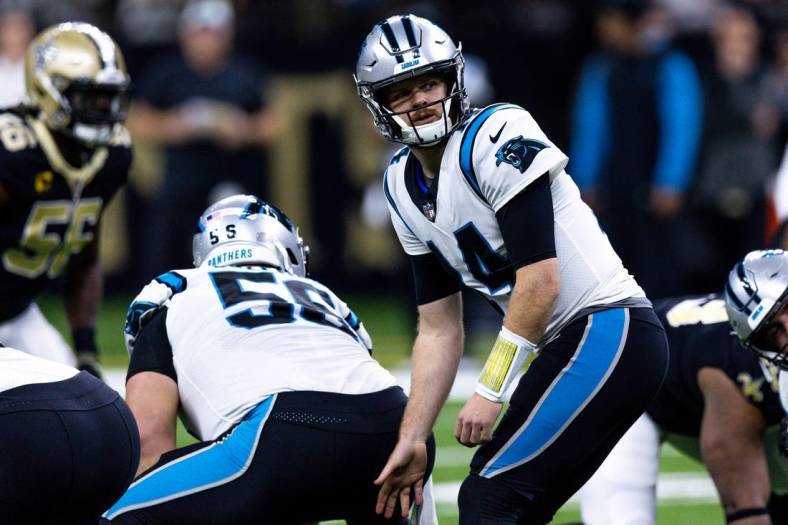 Jan 8, 2023; New Orleans, Louisiana, USA;  Carolina Panthers quarterback Sam Darnold (14) drops back to pass against the New Orleans Saints during the first half at Caesars Superdome. Mandatory Credit: Stephen Lew-USA TODAY Sports