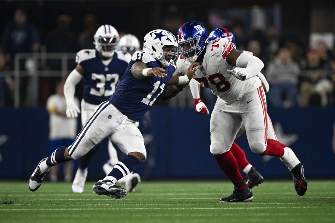 Nov 24, 2022; Arlington, Texas, USA; Dallas Cowboys linebacker Micah Parsons (11) and New York Giants offensive tackle Andrew Thomas (78) in action during the game between the Dallas Cowboys and the New York Giants at AT&T Stadium. Mandatory Credit: Jerome Miron-USA TODAY Sports