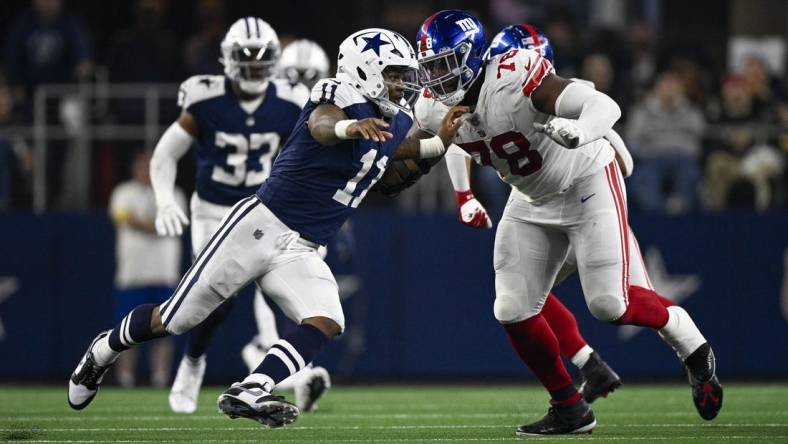 Nov 24, 2022; Arlington, Texas, USA; Dallas Cowboys linebacker Micah Parsons (11) and New York Giants offensive tackle Andrew Thomas (78) in action during the game between the Dallas Cowboys and the New York Giants at AT&T Stadium. Mandatory Credit: Jerome Miron-USA TODAY Sports