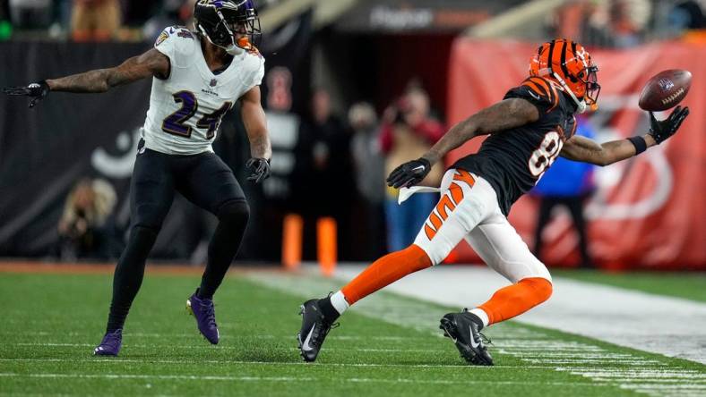 Cincinnati Bengals wide receiver Tee Higgins (85) is unable to hold onto a pass under pressure from Baltimore Ravens cornerback Marcus Peters (24) in the third quarter during an NFL wild-card playoff football game between the Baltimore Ravens and the Cincinnati Bengals, Sunday, Jan. 15, 2023, at Paycor Stadium in Cincinnati. The Bengals advanced to the Divisional round of the playoffs with a 24-17 win over the Ravens.

Baltimore Ravens At Cincinnati Bengals Afc Wild Card Jan 15 302