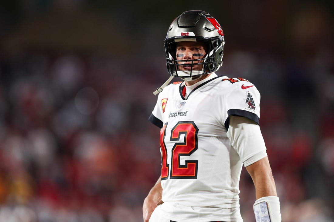 Jan 16, 2023; Tampa, Florida, USA; Tampa Bay Buccaneers quarterback Tom Brady (12) looks on before a  wild card game against the Dallas Cowboys at Raymond James Stadium. Mandatory Credit: Nathan Ray Seebeck-USA TODAY Sports