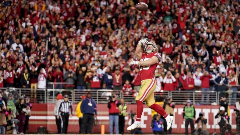 Jan 22, 2023; Santa Clara, California, USA; San Francisco 49ers running back Christian McCaffrey (23) celebrates after scoring a touchdown during the fourth quarter of a NFC divisional round game against the Dallas Cowboys at Levi's Stadium. Mandatory Credit: Kyle Terada-USA TODAY Sports
