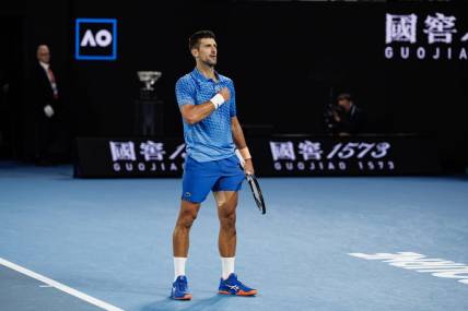 Jan 29, 2023; Melbourne, Victoria, Australia; Novak Djokovic of Serbia celebrates his victory over Stefanos Tsitsipas of Greece in the men's final on day fourteen of the 2023 Australian Open tennis tournament at Melbourne Park. Mandatory Credit: Mike Frey-USA TODAY Sports