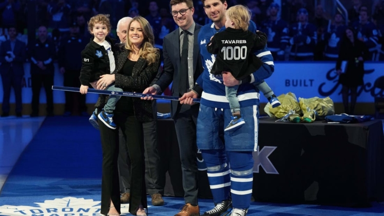 Jan 29, 2023; Toronto, Ontario, CAN; Toronto Maple Leafs center John Tavares (91) receives a commemorative hockey stick from Toronto Maple Leafs General Manager Kyle Dubas for his1000th NHL game ceremony against the Washington Capitals at Scotiabank Arena. Mandatory Credit: Nick Turchiaro-USA TODAY Sports