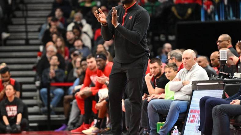 Feb 12, 2023; Toronto, Ontario, CAN;   Toronto Raptors acting head coach Adrian Griffin applaudes his players in the first half against the Detroit Pistons at Scotiabank Arena. Mandatory Credit: Dan Hamilton-USA TODAY Sports