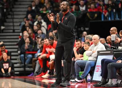 Feb 12, 2023; Toronto, Ontario, CAN;   Toronto Raptors acting head coach Adrian Griffin applaudes his players in the first half against the Detroit Pistons at Scotiabank Arena. Mandatory Credit: Dan Hamilton-USA TODAY Sports