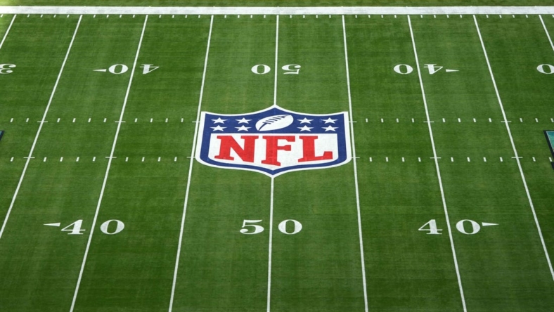 Feb 12, 2023; Glendale, Arizona, USA;The NFL shield and Kansas City Chiefs logos on the field at Super Bowl 57 at State Farm Stadium. Mandatory Credit: Kirby Lee-USA TODAY Sports