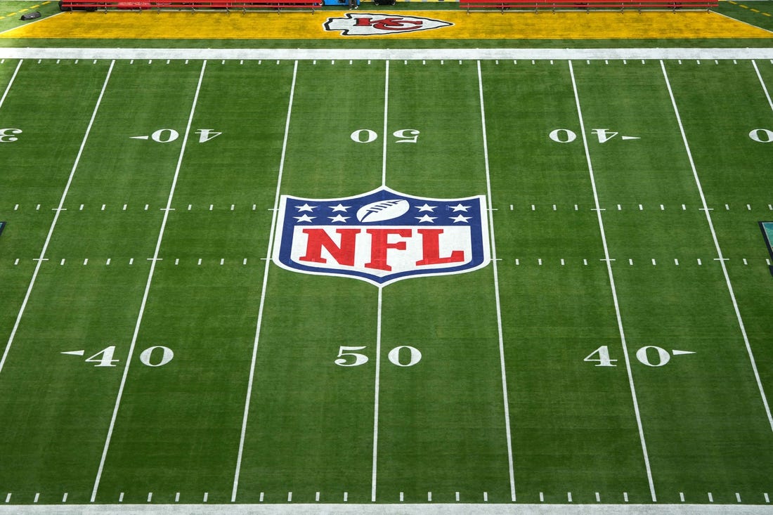 Feb 12, 2023; Glendale, Arizona, USA;The NFL shield and Kansas City Chiefs logos on the field at Super Bowl 57 at State Farm Stadium. Mandatory Credit: Kirby Lee-USA TODAY Sports