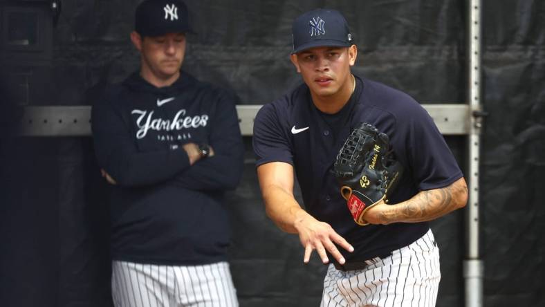 Feb 16, 2023; Tampa, FL, USA; New York Yankees relief pitcher Jonathan Loaisiga (43) pitches during spring training practice at George M. Steinbrenner Field. Mandatory Credit: Kim Klement-USA TODAY Sports