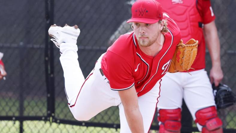 Feb 17, 2023; West Palm Beach, FL, USA;   Washington Nationals starting pitcher Jake Irvin (74) throws bullpen pitches during spring training workouts at the Ballpark of the Palm Beaches. Mandatory Credit: Reinhold Matay-USA TODAY Sports