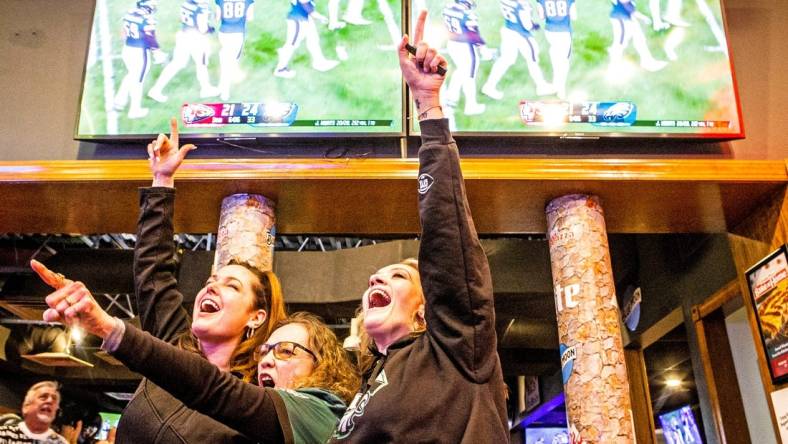 From left, Philadelphia Eagles fans Jennifer Sult, Wanda Paris and Stephanie Napier hug in celebration of a touchdown during a watch party for the Eagles vs. Kansas City Chiefs Super Bowl LVII game at Grotto Pizza in Wilmington, Sunday, Feb. 12, 2023.

P4wil Super Bowl 021223