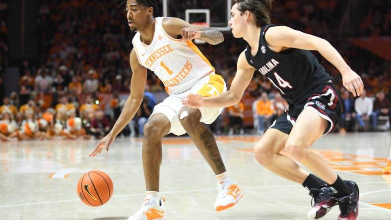 Tennessee guard B.J. Edwards (1) dribbles while defended by South Carolina guard Eli Sparkman (14) during an NCAA college basketball game between the South Carolina Game Cocks and the Tennessee Volunteers in Thompson-Boling Arena in Knoxville, Saturday Feb. 25, 2023.

Volssc0225 0944