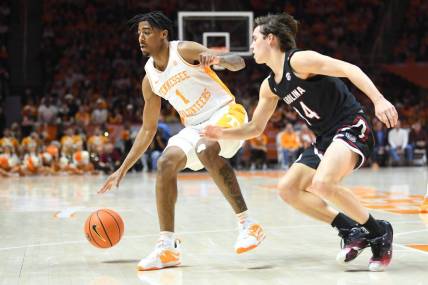 Tennessee guard B.J. Edwards (1) dribbles while defended by South Carolina guard Eli Sparkman (14) during an NCAA college basketball game between the South Carolina Game Cocks and the Tennessee Volunteers in Thompson-Boling Arena in Knoxville, Saturday Feb. 25, 2023.

Volssc0225 0944