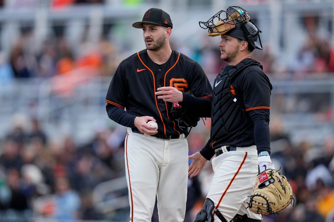 San Francisco Giants pitcher Thomas Szapucki is visited at the mound by catcher Patrick Bailey in the sixth inning of the MLB Cactus League spring training game between the San Francisco Giants and the Cincinnati Reds at Scottsdale Stadium in Goodyear, Ariz., on Sunday, Feb. 26, 2023. The Giants came back in the ninth inning to win on a walk-off single off the bat of Will Wilson.

Cincinnati Reds At San Francisco Giants Spring Training