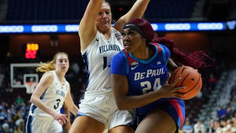 Mar 4, 2023; Uncasville, CT, USA; DePaul Blue Demons forward Aneesah Morrow (24) drives the ball against Villanova Wildcats forward Megan Olbrys (14) in the second half at Mohegan Sun Arena. Mandatory Credit: David Butler II-USA TODAY Sports