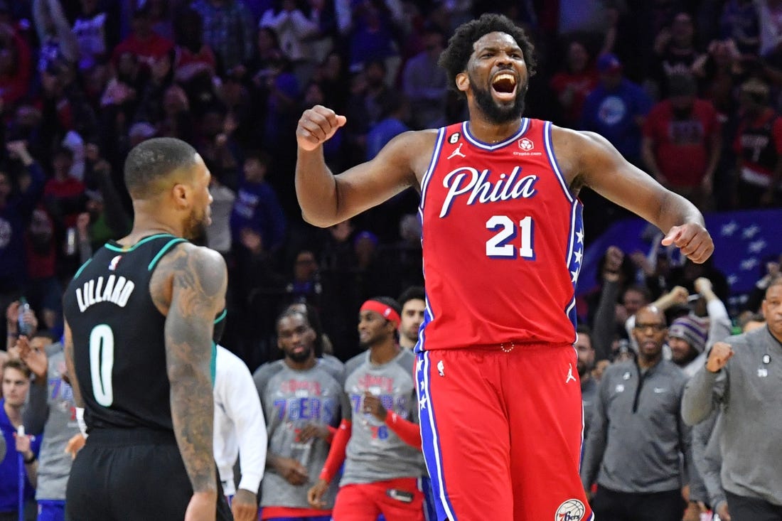 Mar 10, 2023; Philadelphia, Pennsylvania, USA; Philadelphia 76ers center Joel Embiid (21) celebrates win over Portland Trail Blazers guard Damian Lillard (0) at Wells Fargo Center. Mandatory Credit: Eric Hartline-USA TODAY Sports