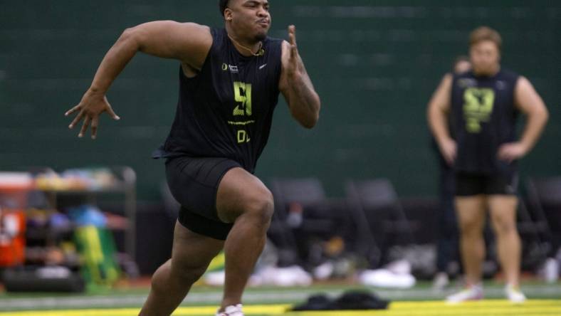 Defensive lineman Jordon Riley runs during Oregon Pro Day at the Moshofsky Center Tuesday March 14, 2023.

Eug 031423 Pro Day 03