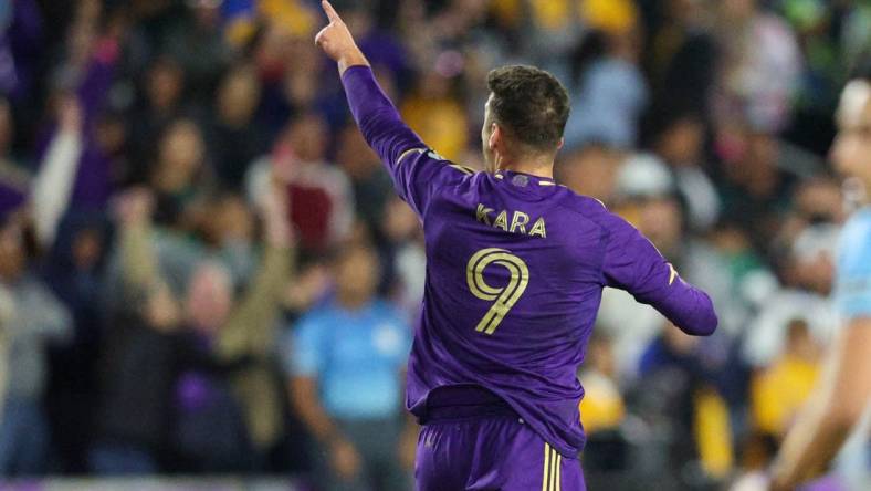 Mar 15, 2023; Orlando, FL, USA;  Orlando City SC forward Ercan Kara (9) celebrates after scoring a goal against Tigres UANL in the second half during the CONCACAF Champions League at Exploria Stadium. Mandatory Credit: Nathan Ray Seebeck-USA TODAY Sports