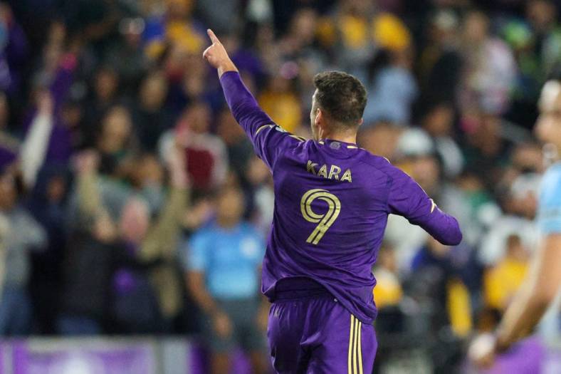 Mar 15, 2023; Orlando, FL, USA;  Orlando City SC forward Ercan Kara (9) celebrates after scoring a goal against Tigres UANL in the second half during the CONCACAF Champions League at Exploria Stadium. Mandatory Credit: Nathan Ray Seebeck-USA TODAY Sports