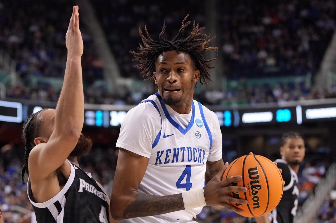 Mar 17, 2023; Greensboro, NC, USA; Kentucky Wildcats forward Daimion Collins (4) controls the ball against Providence Friars guard Jared Bynum (4) in the second half at Greensboro Coliseum. Mandatory Credit: Bob Donnan-USA TODAY Sports