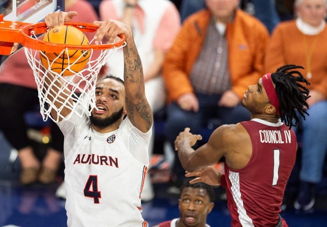 Auburn Tigers forward Johni Broome (4) dunks the ball as Auburn Tigers take on Arkansas Razorbacks at Neville Arena in Auburn, Ala., on Saturday, Jan. 7, 2023. Auburn Tigers defeated Arkansas Razorbacks 72-59.