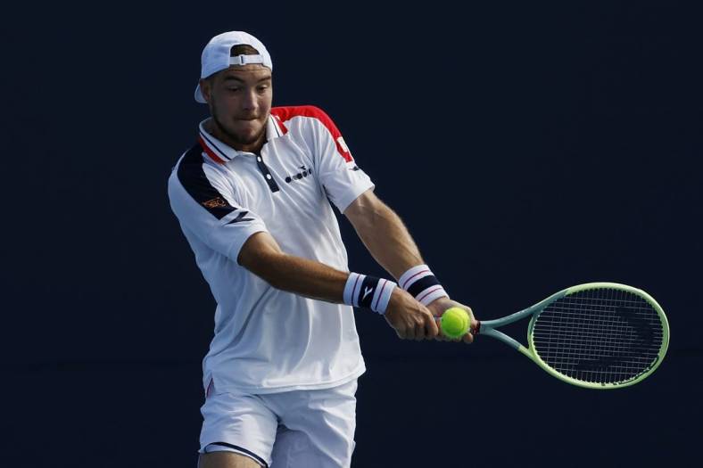 Mar 21, 2023; Miami, Florida, US; Jan-Lennard Struff (BEL) hits a backhand against Zhizhen Zhang (CHN) (not pictured) on day two of the Miami Open at Hard Rock Stadium. Mandatory Credit: Geoff Burke-USA TODAY Sports