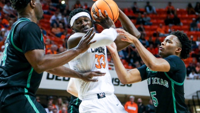 Oklahoma State forward Moussa Cisse (33) works past defenders in the first half during a college basketball game in the quarterfinals of the National Invitational Tournament between the Oklahoma State Cowboys (OSU) and the North Texas Mean Green at Gallagher-Iba Arena in Stillwater, Okla., Tuesday, March 21, 2023.

Osu Vs Nt