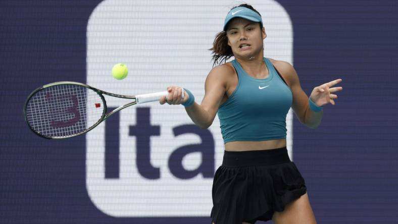 Mar 22, 2023; Miami, Florida, US; Emma Raducanu (GBR) hits a forehand against Bianca Andreescu (CAN) (not pictured) on day three of the Miami Open at Hard Rock Stadium. Mandatory Credit: Geoff Burke-USA TODAY Sports