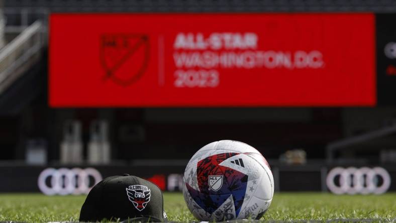 Mar 14, 2023; Washington, DC, USA; A view of a D.C. United hat, an official MLS game ball, and an All Star scarf after an announcement that Premier League club Arsenal will play the MLS All Stars at the MLS All-Star Game in Washington D.C at Audi Field. Mandatory Credit: Geoff Burke-USA TODAY Sports