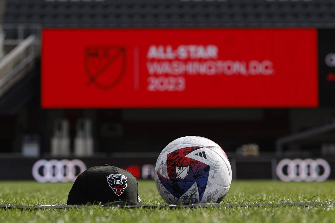Mar 14, 2023; Washington, DC, USA; A view of a D.C. United hat, an official MLS game ball, and an All Star scarf after an announcement that Premier League club Arsenal will play the MLS All Stars at the MLS All-Star Game in Washington D.C at Audi Field. Mandatory Credit: Geoff Burke-USA TODAY Sports