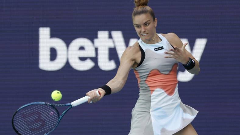 Mar 24, 2023; Miami, Florida, US; Maria Sakkari (GRE) hits a forehand against Bianca Andreescu (CAN) (not pictured) on day five of the Miami Open at Hard Rock Stadium. Mandatory Credit: Geoff Burke-USA TODAY Sports